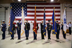 A color guard represents the branches of the U.S. military